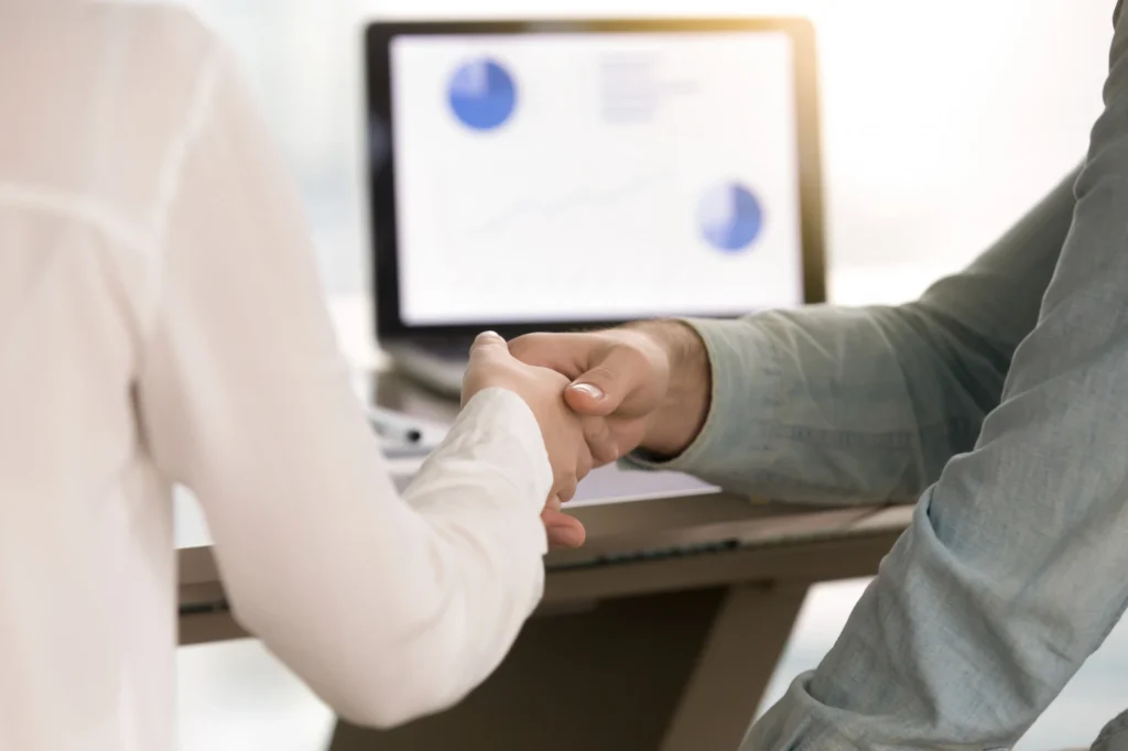 Woman using her smartphone to manage client information through Shifton’s client management feature.