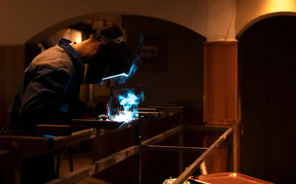 Technician performing extrusion welding on plastic piping at a construction site — Shifton Field Service