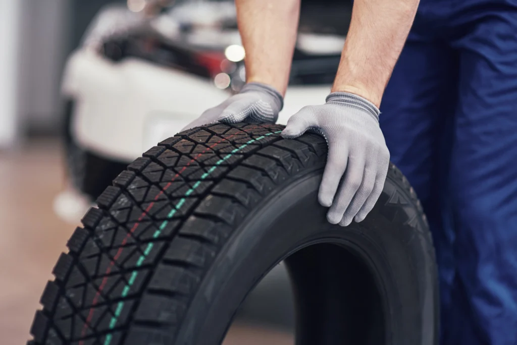 Technician changing a truck tire on the side of the road — Shifton Field Service