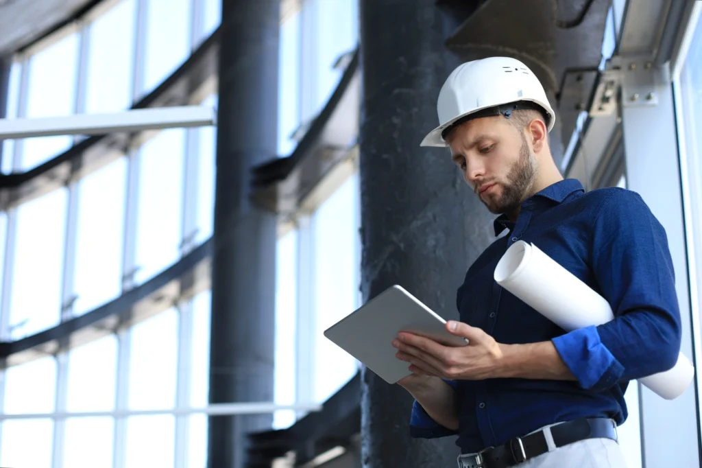 Facility manager inspecting building systems and maintenance operations